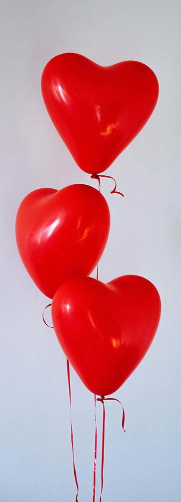 red heart shaped helium balloons