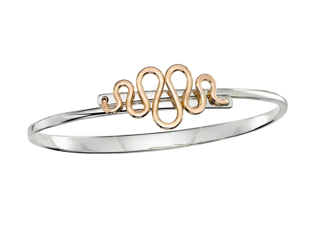 E.L. Designs Sterling silver with 14k coil accent, swing-open function MSRP $705 eldesigns.com 800.828.1122