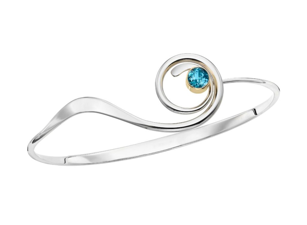 E.L. Designs Sterling silver with 14k bezel, 5mm blue topaz MSRP $410 eldesigns.com 800.828.1122